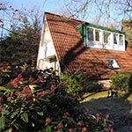 Vakantiehuis van de achterzijde na de verbouwing met de nieuwe dakkapel.